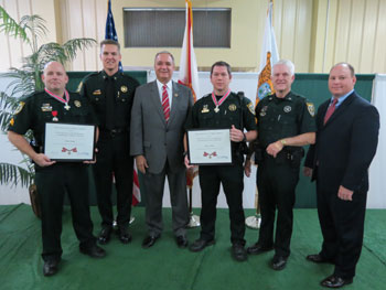 Investigators Steve Hough and Todd Watkins with Florida 1st District Congressman Jeff Miller (third from left).